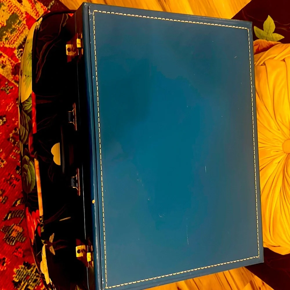 Antique briefcase portable bed for small pets! Purchased from Etsy.